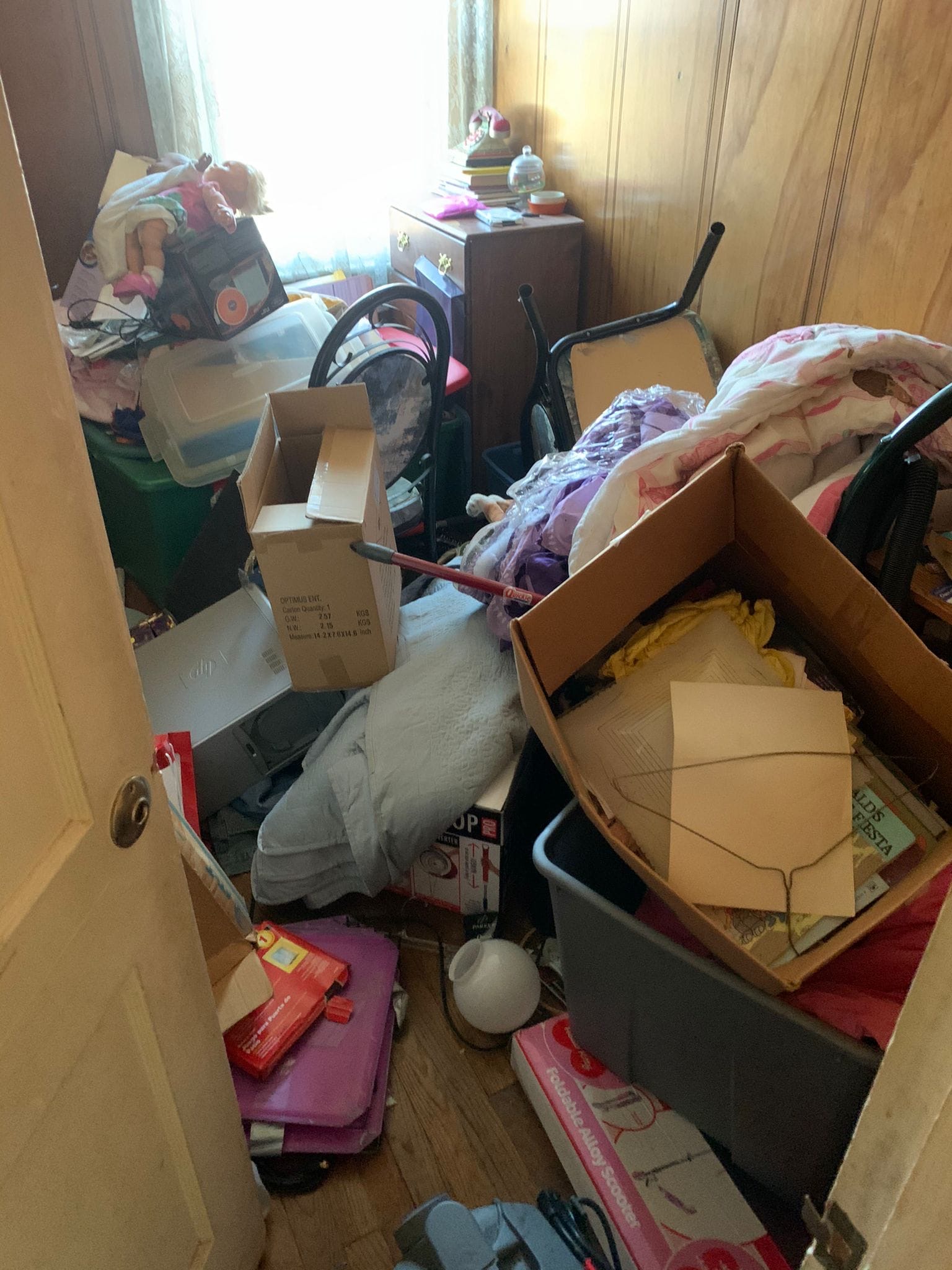 Packed room with boxes and household goods during an estate cleanout